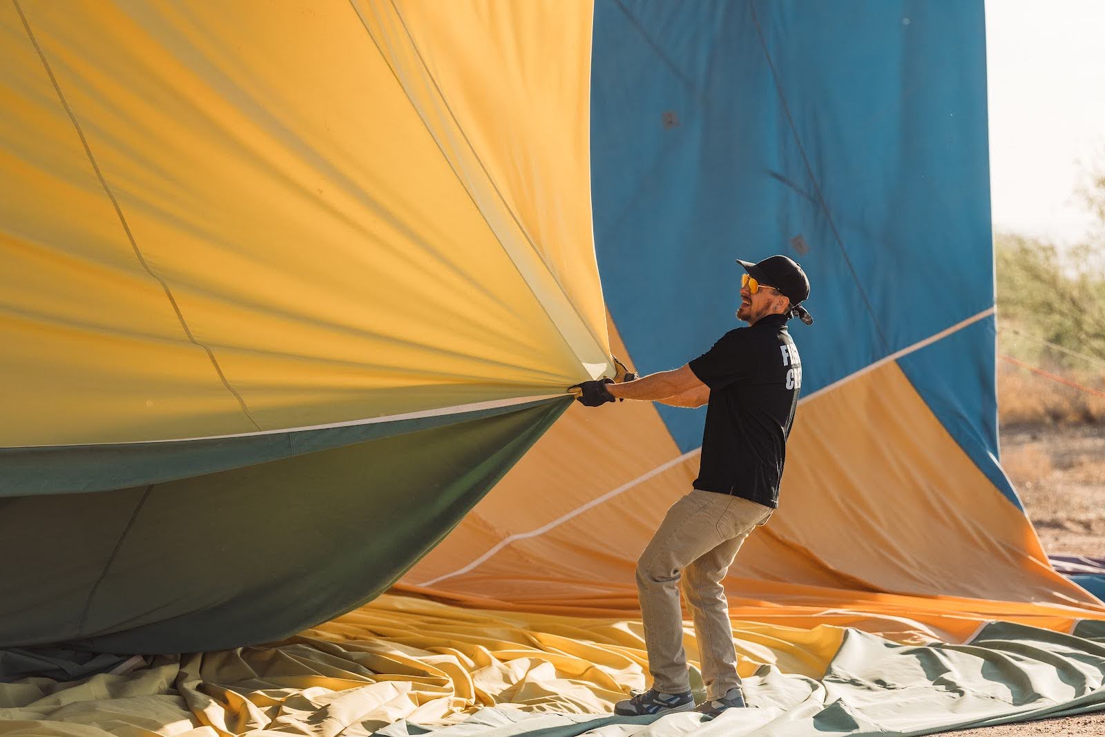 a man setting up a hot air balloon