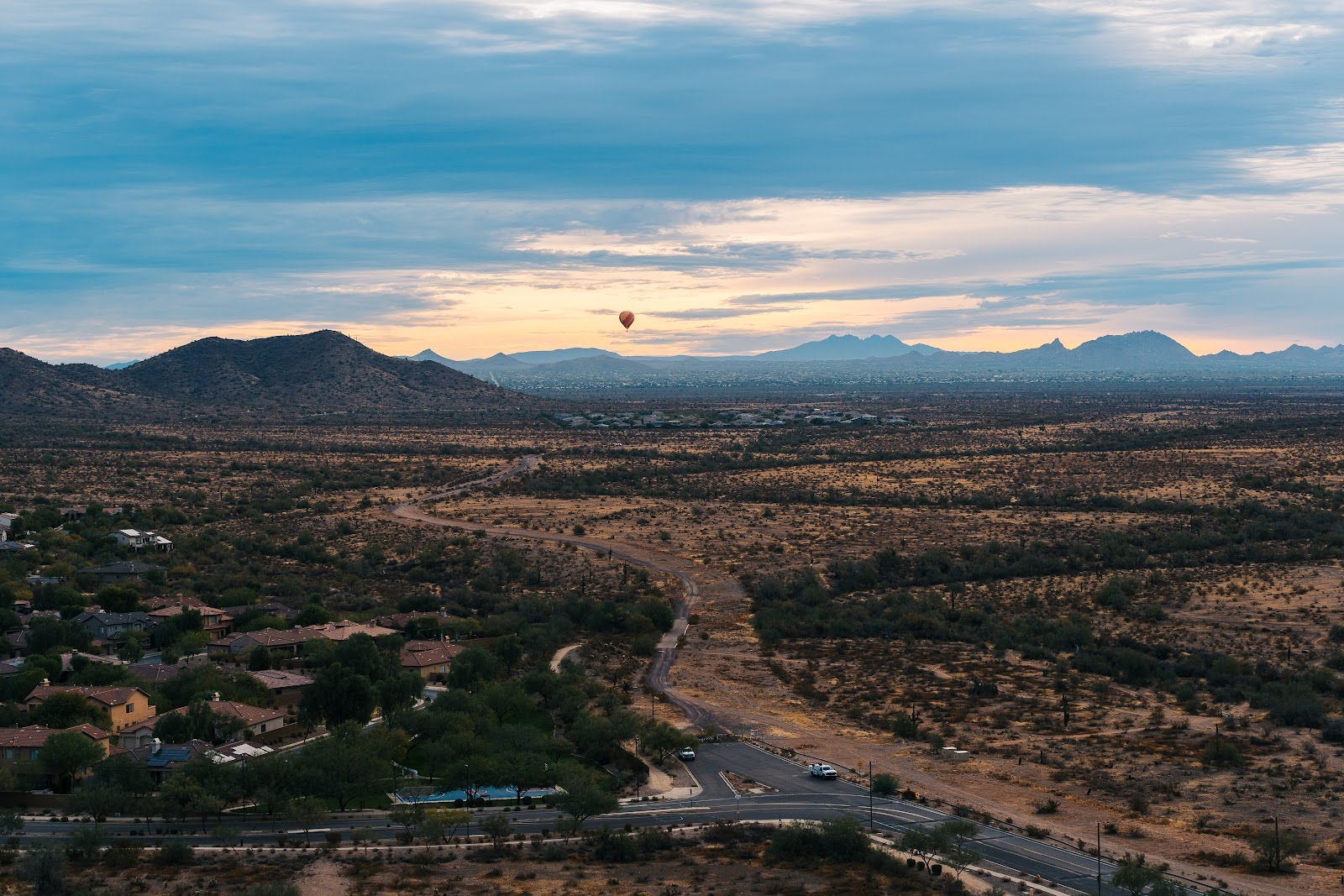 hot air balloon over a sunset in arizona